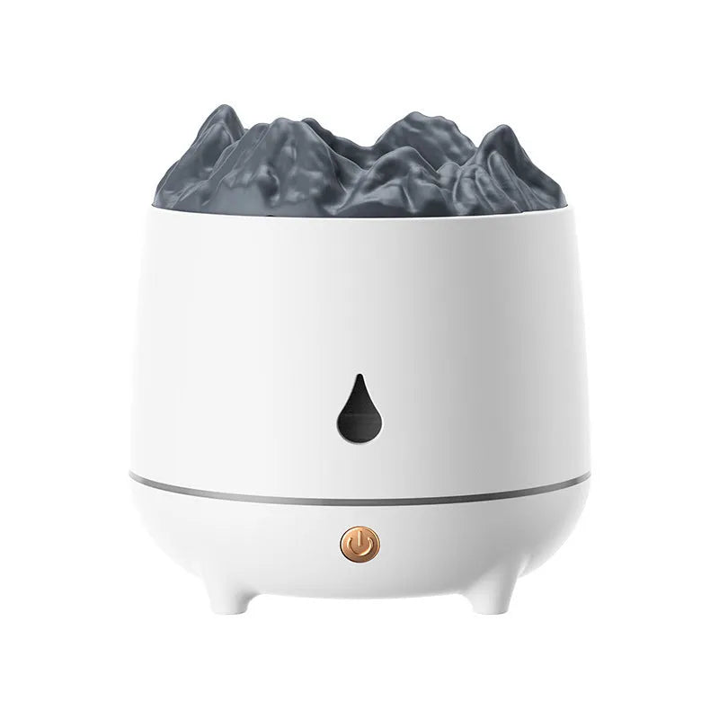 Black and white volcano-shaped ultrasonic humidifier with USB cable on a wooden surface.