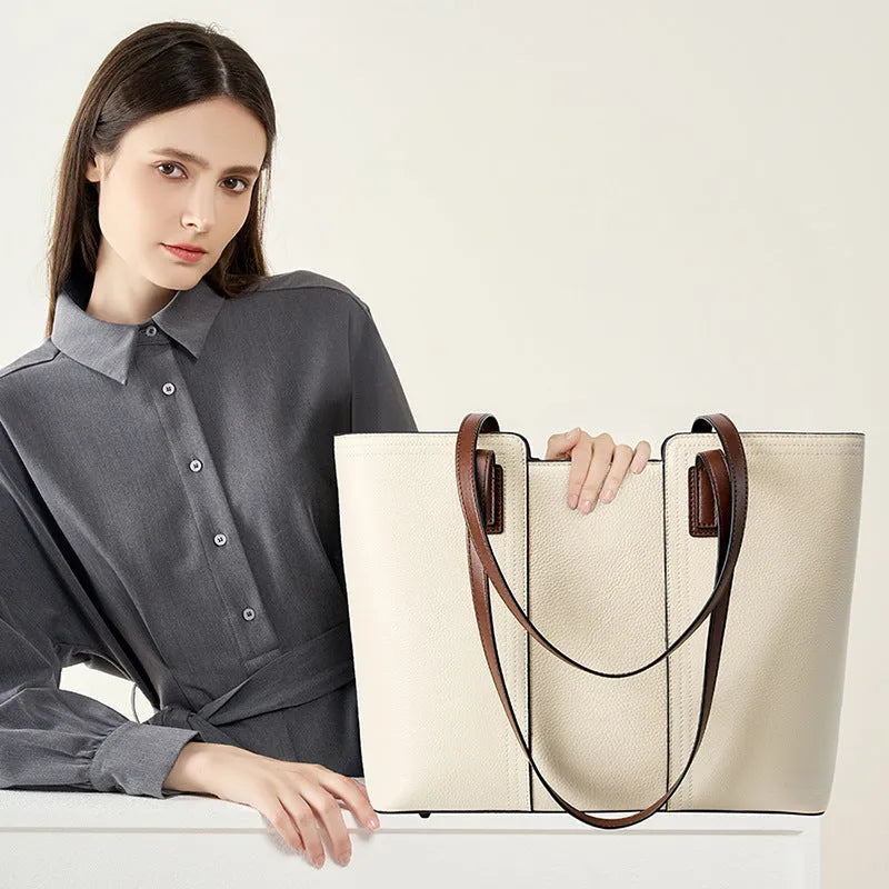 Women's black genuine leather crossbody bag with square shape and single shoulder strap.