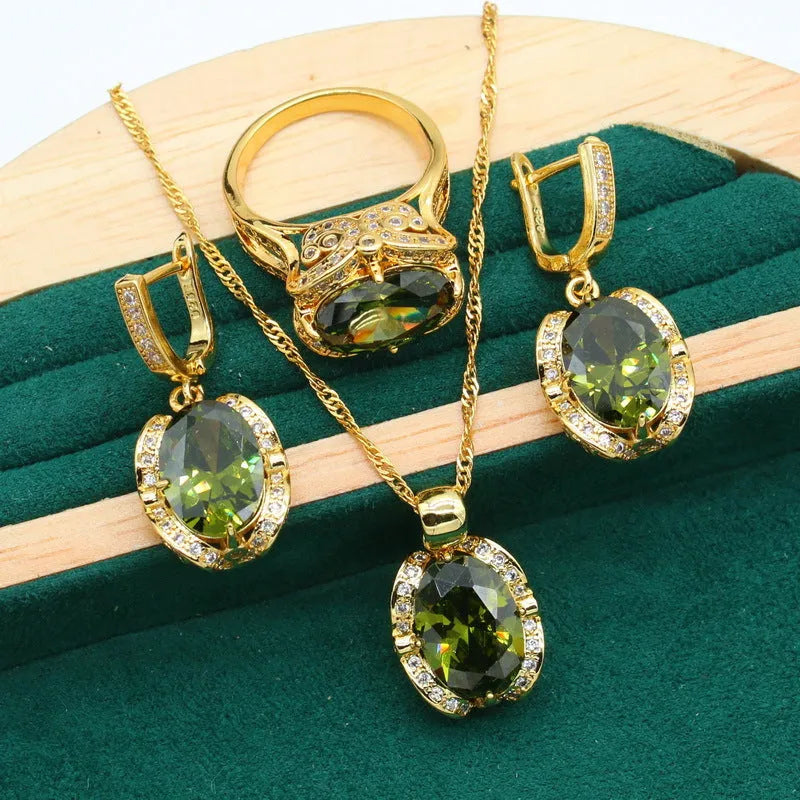 Olive green rhinestone zircon jewellery set with snake bone chain necklace, matching earrings, and ring.