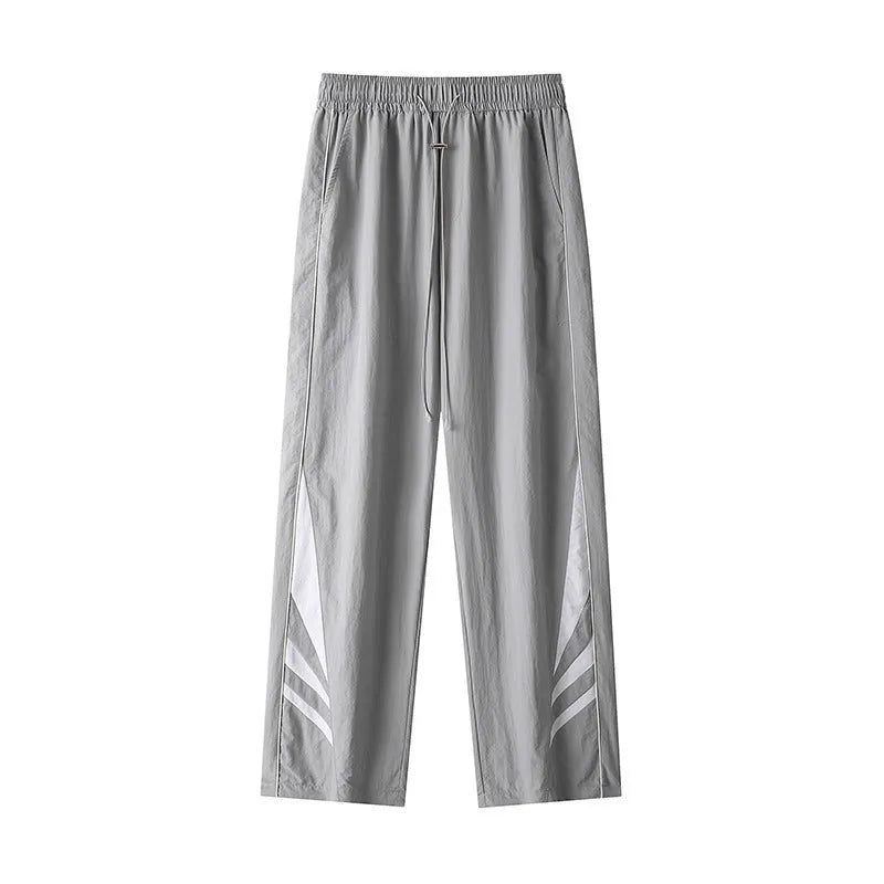 Men's straight leg casual trousers in black, featuring a mid waist with elastic and a cardigan button fly.