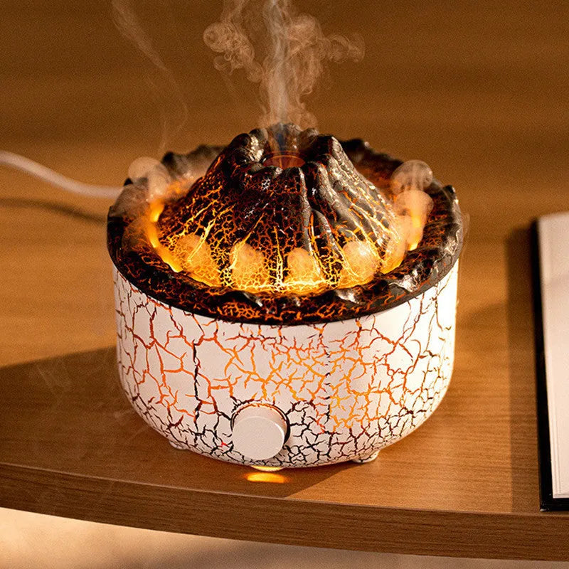 Column-shaped volcano humidifier diffuser emitting coloured mist and LED light flame effect.