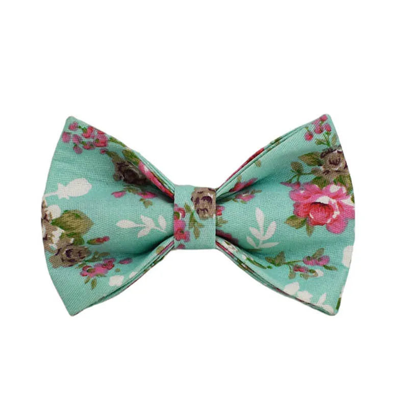 Rose pattern fabric dog collar set with green background including collar, leash, and detachable bow