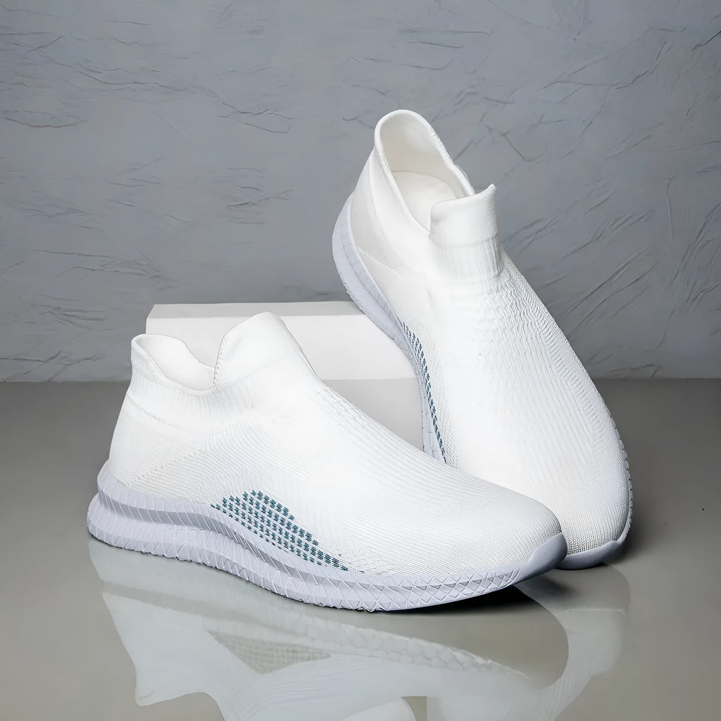 Popcorn flyknit fabric casual sneaker in black, low top with round toe and flat heel.