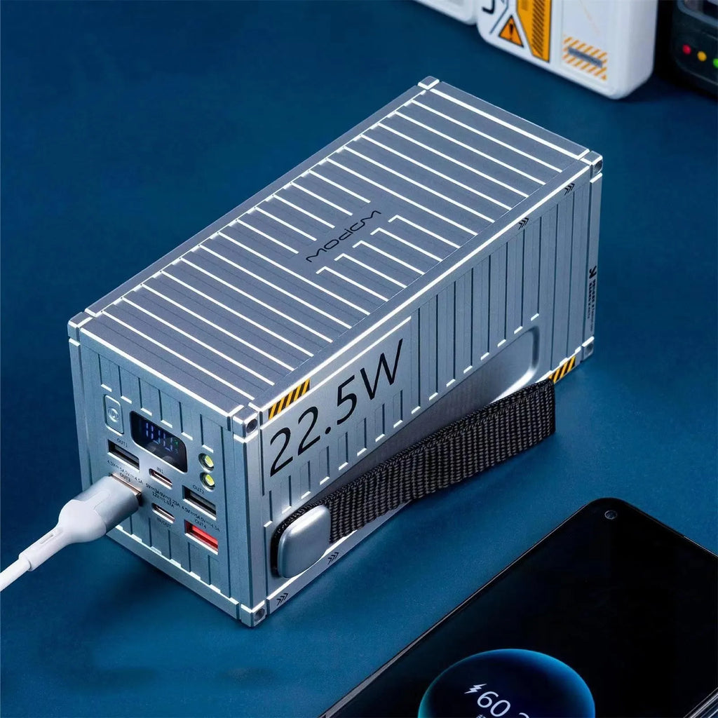 Yellow, black, and silver 50000mAh power bank with digital display screen and multiple USB ports.