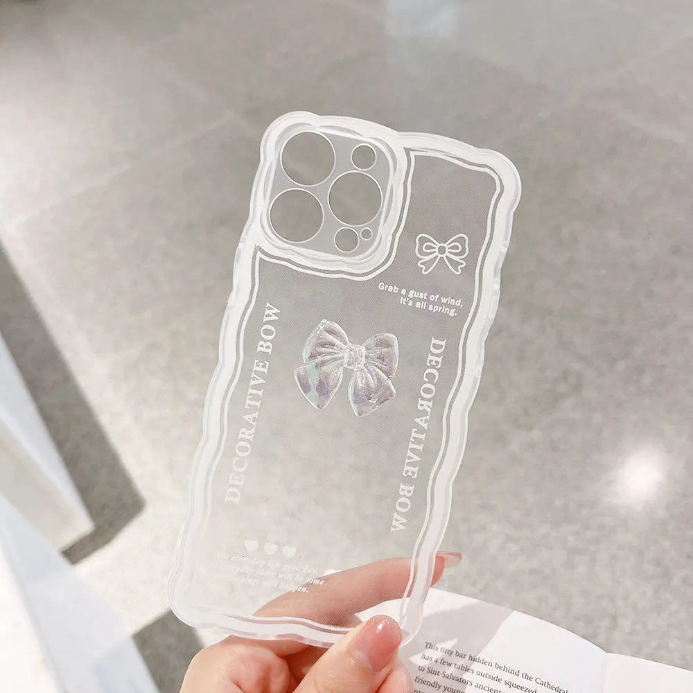 Transparent iPhone case with a raised 3D ice-through bow design on the back.