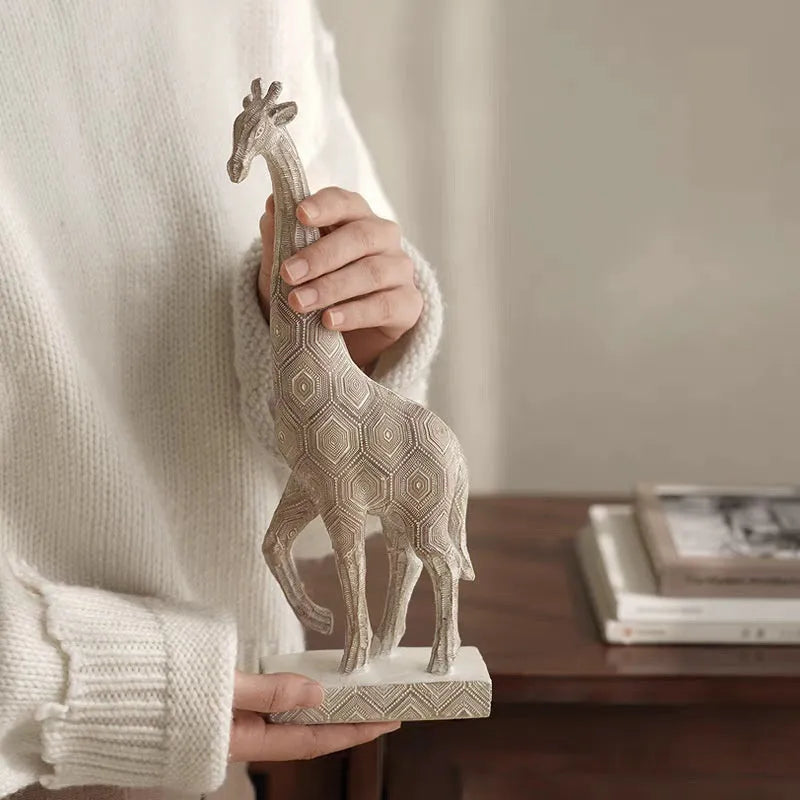 Wood colour synthetic resin giraffe ornament sculpture measuring 30.5cm tall on display.