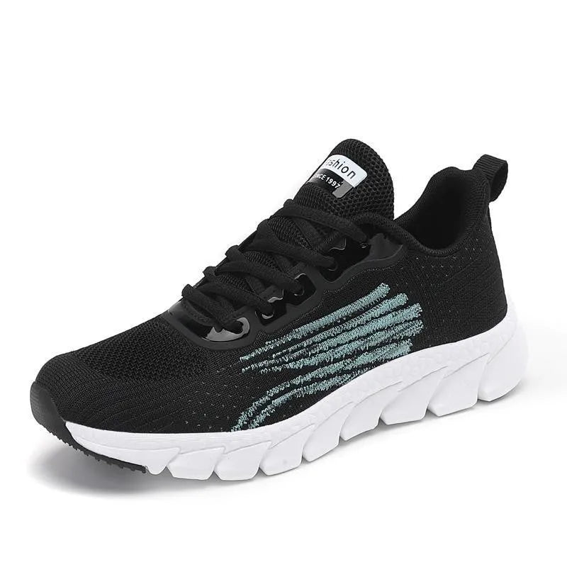 Women's low-top black and white running sneakers with cross-strap detail and MD sole.