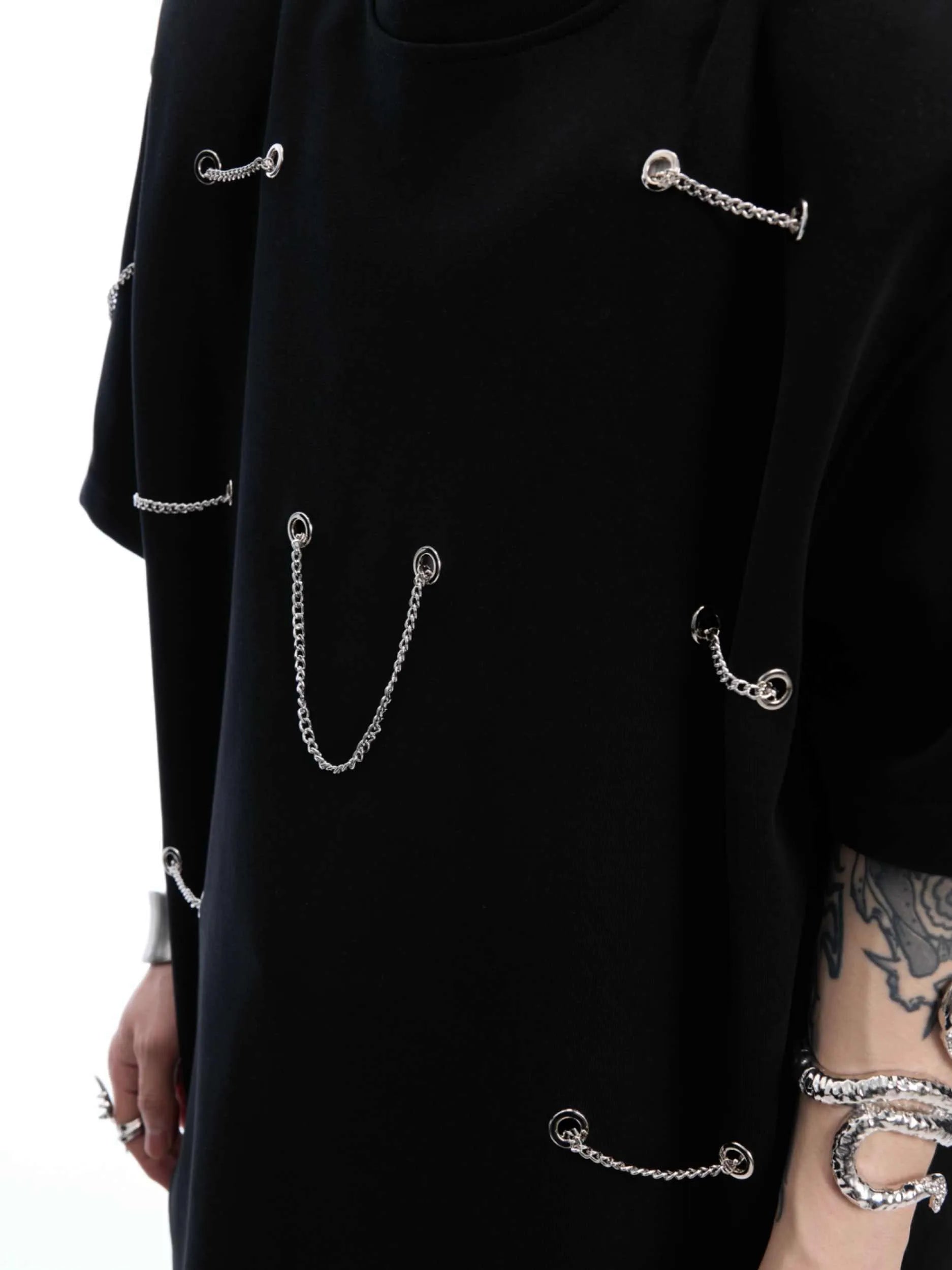 Black men's T-shirt with padded shoulders and metal chain detail, short sleeves, round neck
