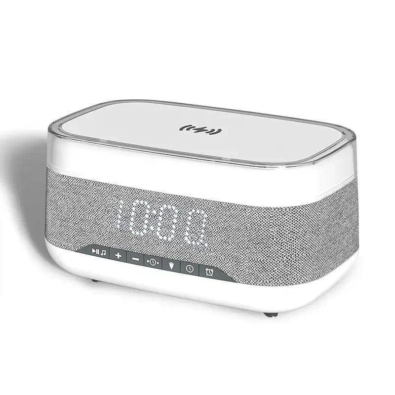 White multifunctional alarm clock unit with Bluetooth speaker and wireless charging pad.