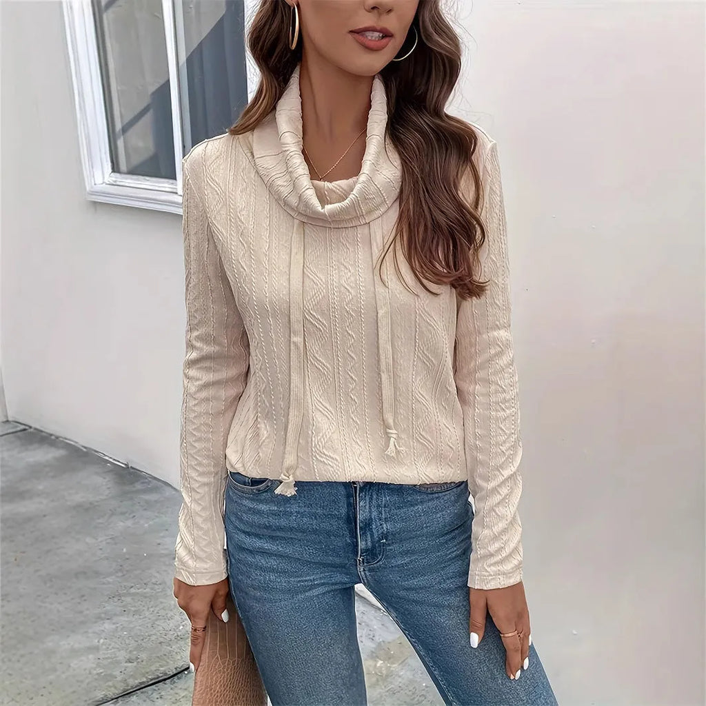 Apricot hooded pullover sweater with long sleeves on hanger
