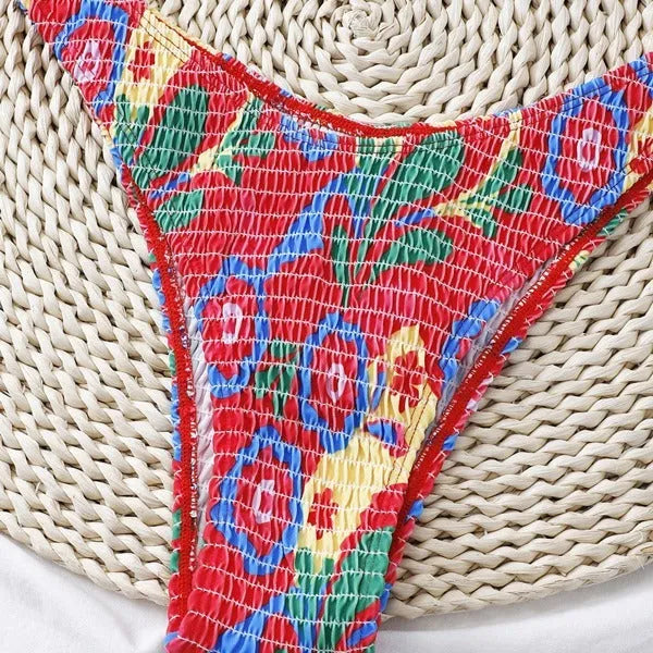 Red floral pattern women's underwire triangle bikini swimsuit with briefs, shown on a model.