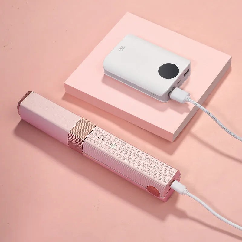 Pink and green mini cordless USB hair straightener with ceramic plates for travel