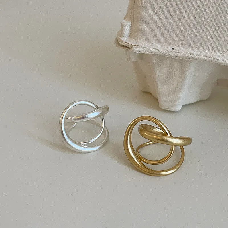 Three-dimensional interlaced matte metal open ring with geometric design in gold or silver electroplated finish