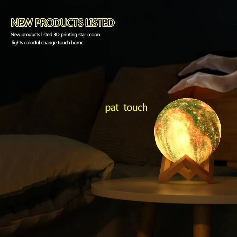 White spherical lunar night light with textured surface and glowing LED illumination on a dark surface.