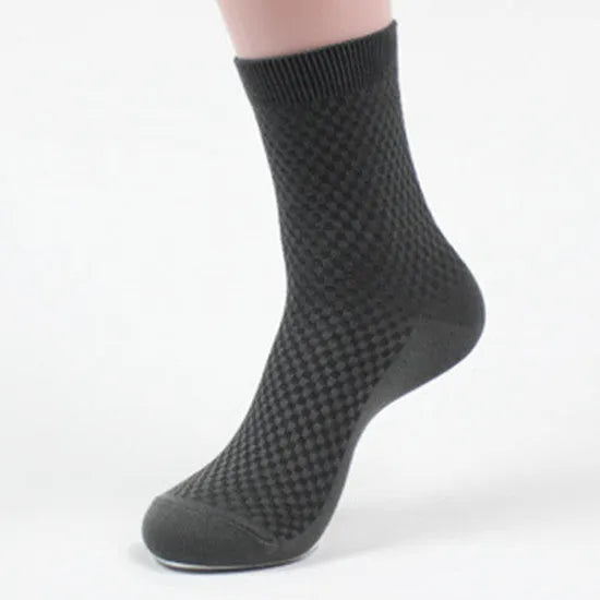 Men's bamboo fibre crew sock with small square pattern in black, navy, grey, and grey-blue colours.