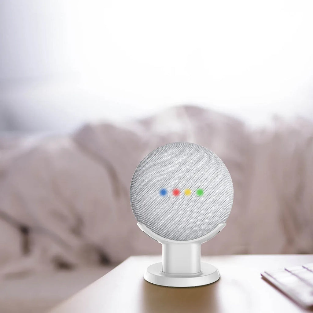 Black PlusAcc Google Home Mini stand with plug-in base on a table.