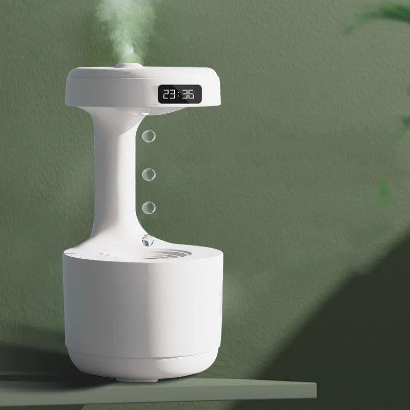 Bedroom anti-gravity humidifier with clock and backflow aroma diffuser in white plastic on desk with LED display