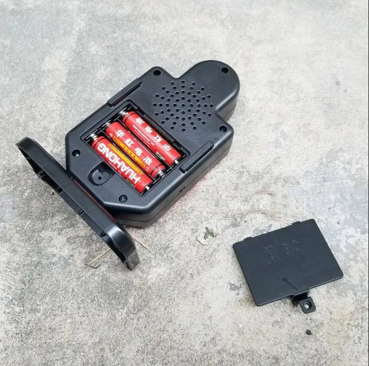 Plastic laser target with light and sound effects, dimensions 9 by 4.7 by 12.8 cm