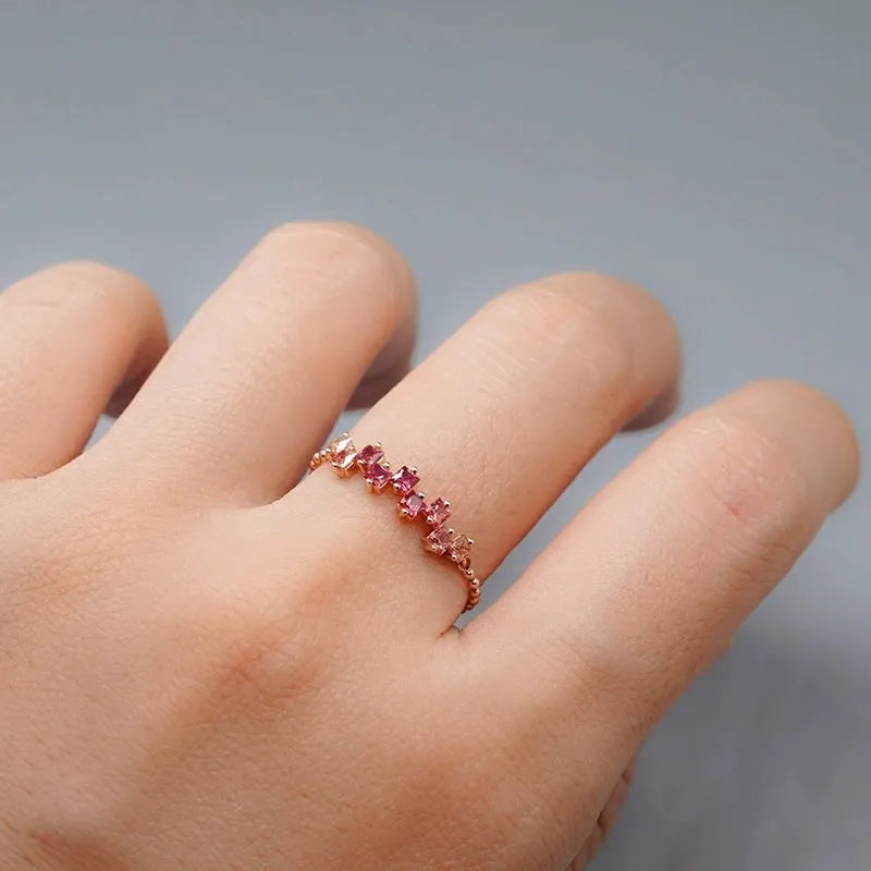 Square blue stone ring with adjustable copper band and floral leaf detailing in blue