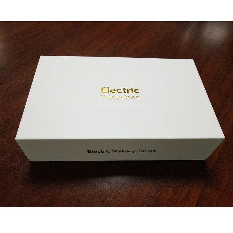 Electric makeup brush with foundation head and blush head, black, on a white background