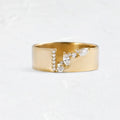 Women's gold electroplated zircon ring on finger showing brilliant stones and metallic finish