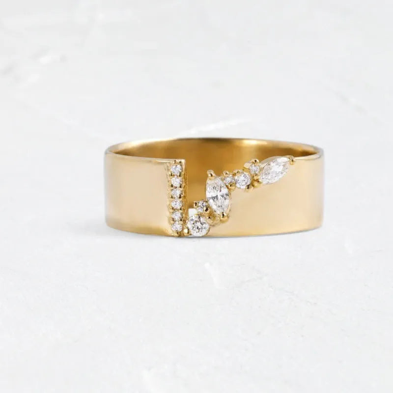 Women's gold electroplated zircon ring on finger showing brilliant stones and metallic finish