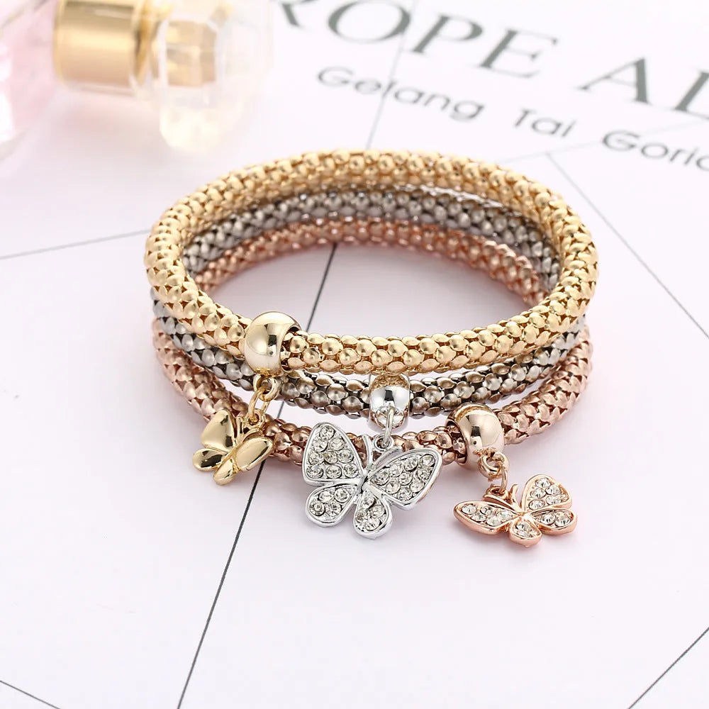 Alloy tricolour stretch popcorn corn chain bracelet set with themed charms in selected colour option