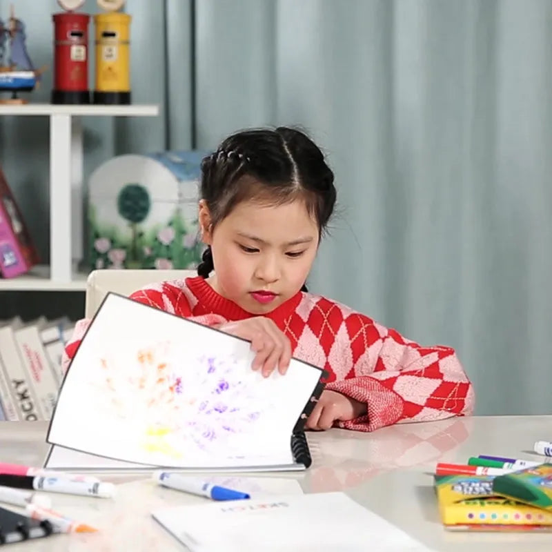 Children's A4 drawing book with PP cover, 15 pages, in orange colour, laid open on a desk