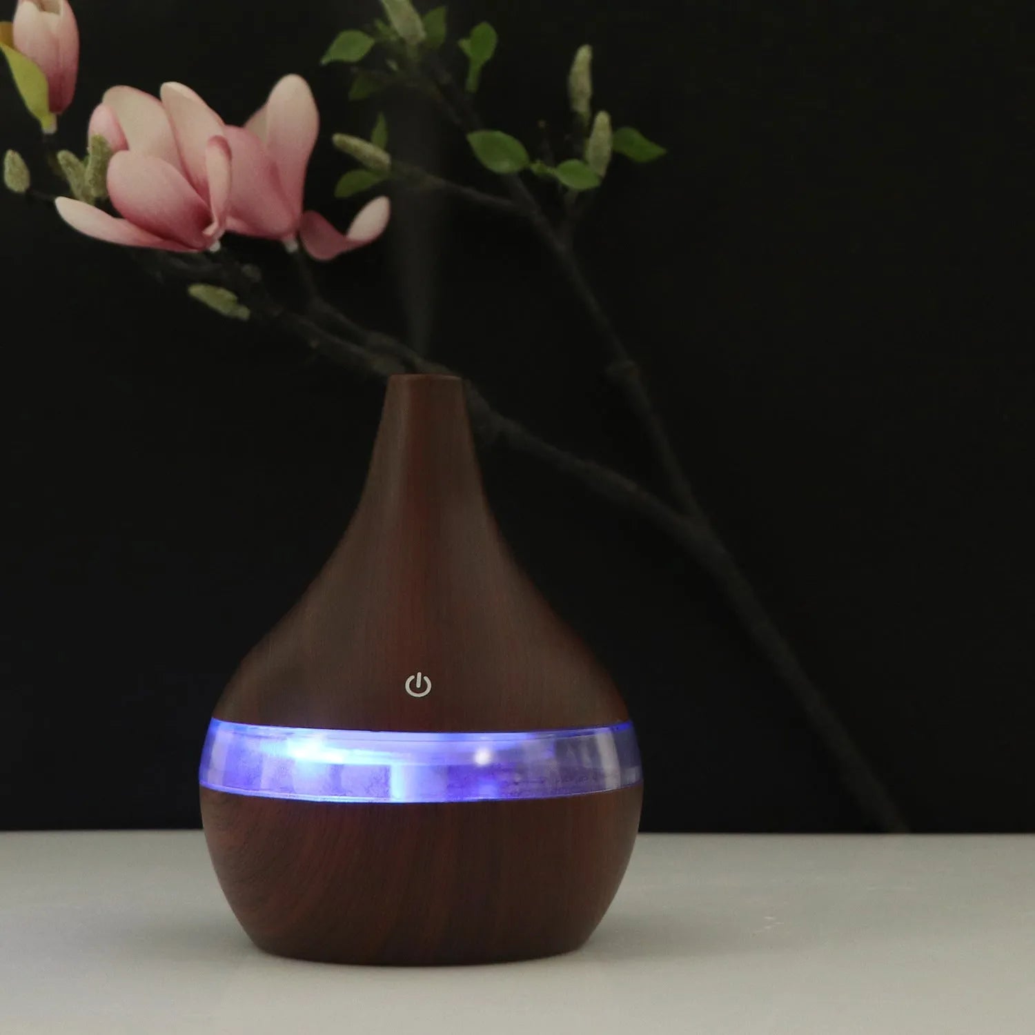 USB-powered mini air purifier humidifier in a wood grain columnar design for small rooms.