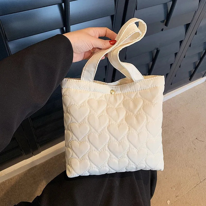 Large capacity women's shoulder bag in Oxford fabric with double-joint straps, bucket shape, and phone pocket.