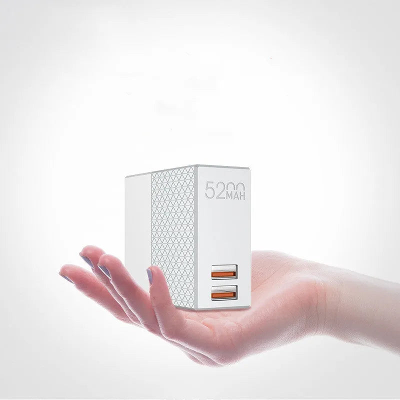 White two-in-one power bank charger with integrated plug, showing UK/US/EU pins and 5200mAh capacity.