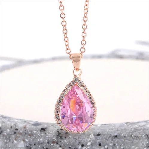 Geometric drop shape alloy necklace with rhinestone accents in rose gold pink finish