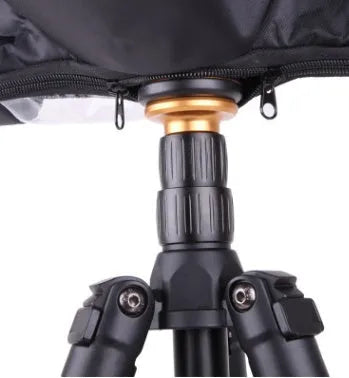 Waterproof rain cover fitted over a DSLR camera with a long telephoto lens attached.