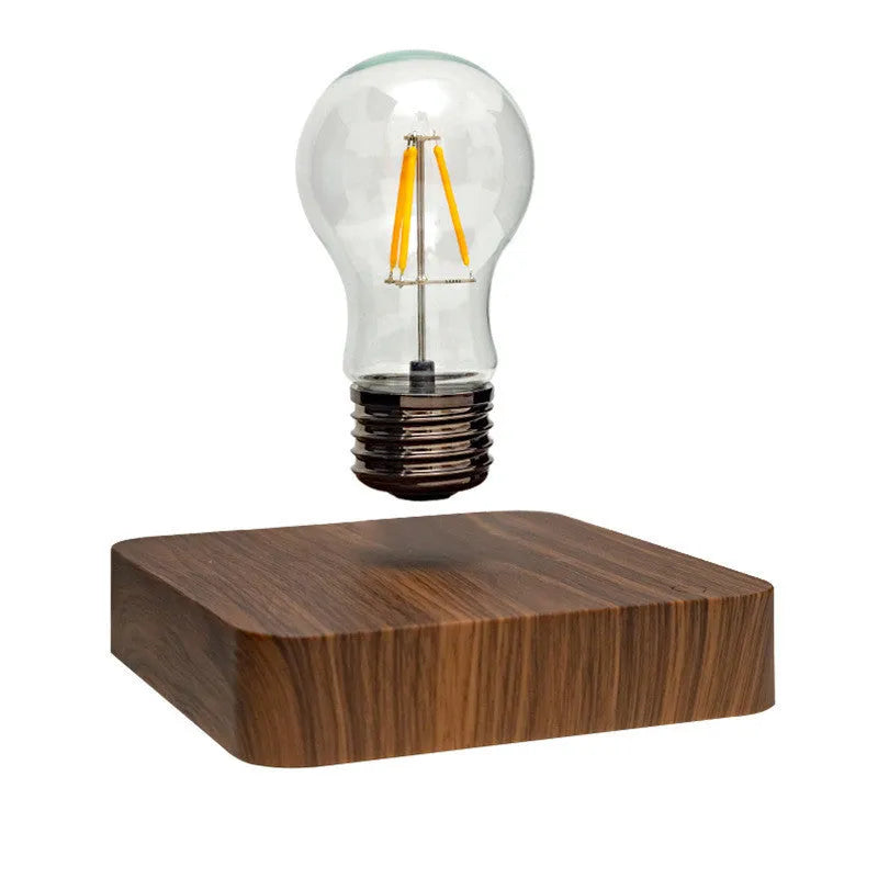 Self-rotating maglev bulb with warm yellow light, ABS base, 6cm diameter bulb, and 13.5cm diameter base.