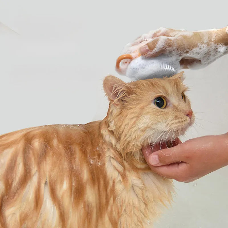 Orange silicone dog bath brush with shampoo dispenser and massage bristles for pet grooming