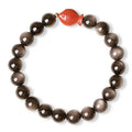 Natural obsidian round bead bracelet with a red cinnabar fungus charm, showing different bead size options.