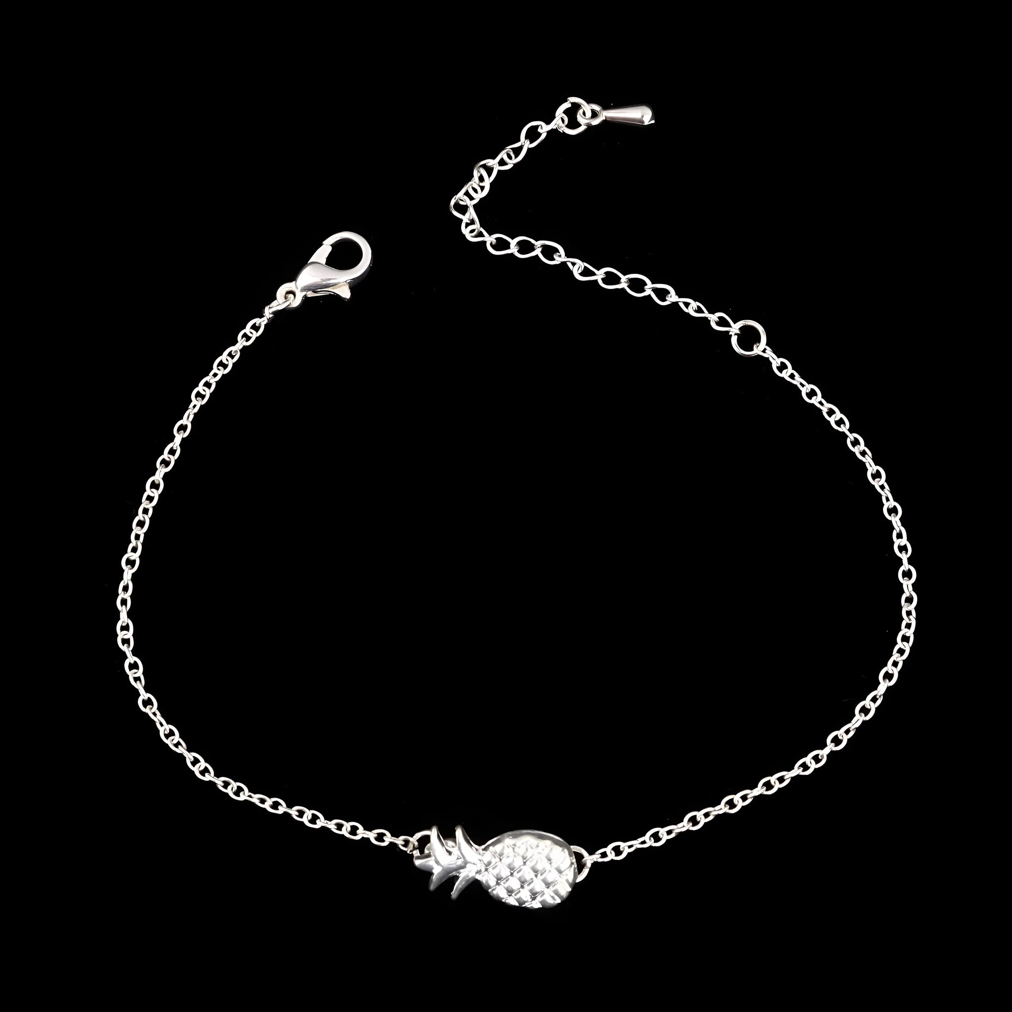 Women's alloy bracelet with a simple pineapple charm in a choice of gold or silver metallic finish.