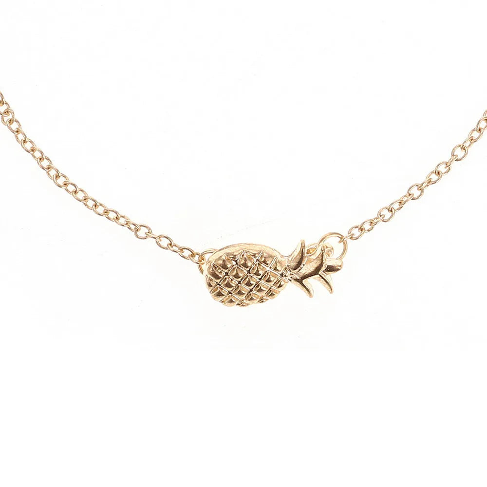 Women's alloy bracelet with a simple pineapple charm in a choice of gold or silver metallic finish.