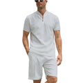 Men's solid colour polo shirt and trouser two-piece set in beaded bird's eye polyester fabric.