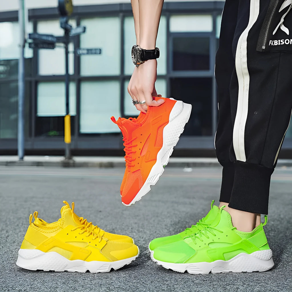Men's green mesh low-top casual shoes with cross straps and flat sole.