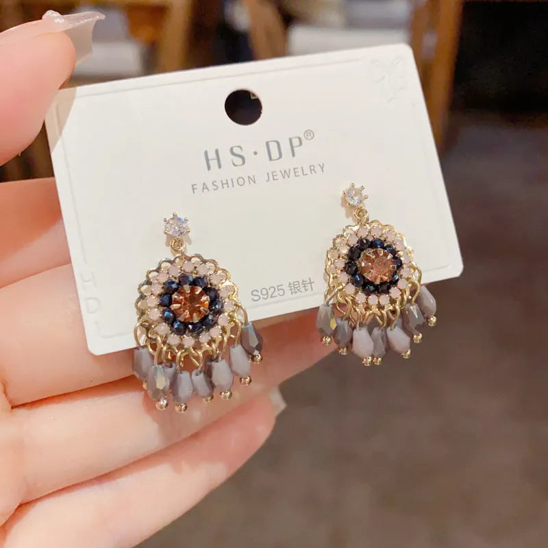 Geometric diamond-embedded crystal tassel earrings in thick gold-plated copper, purple and blue colour options
