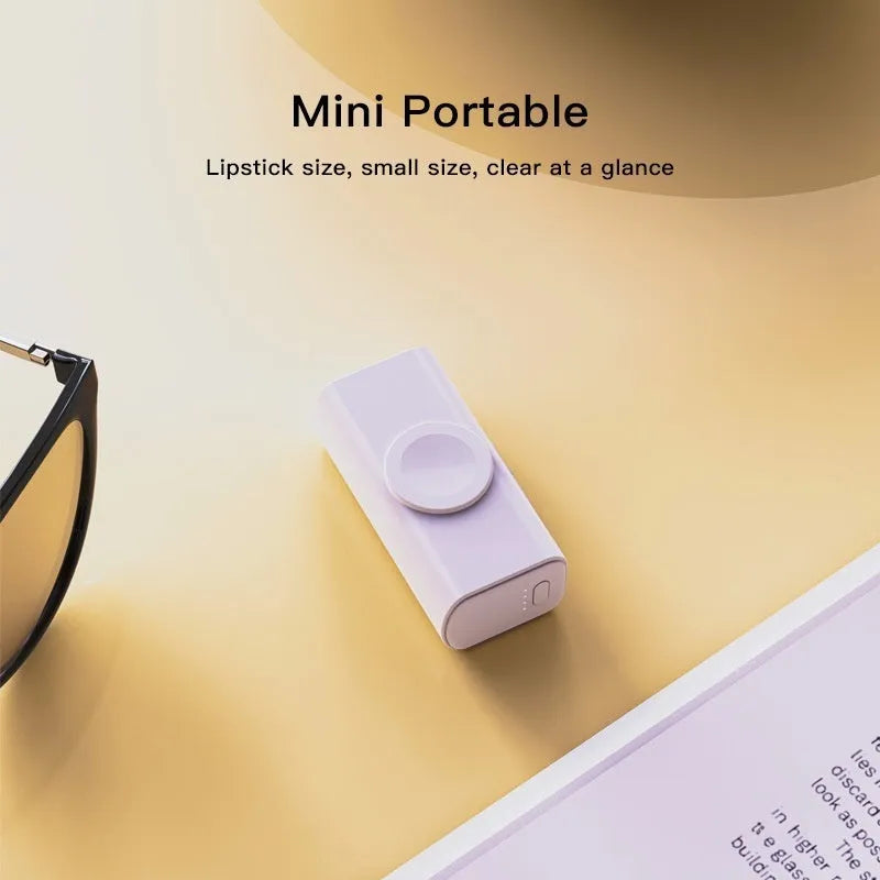 Portable 5000mAh power bank with folding double head charger, compact capsule design in black plastic