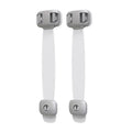 Grey adjustable child safety strap lock with adhesive pads, shown securing a kitchen cabinet door.