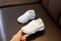 Children's lazy slip-on shoes in white, black, pink, or grey with fabric upper and rubber sole.