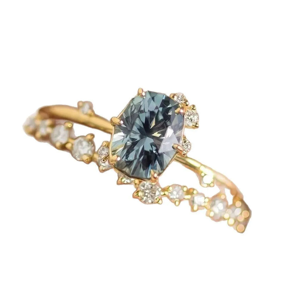 Gold-plated women's ring with green zircon floral design showing side profile