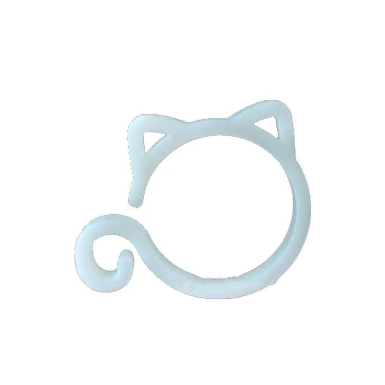 A red cat-shaped plastic clip for holding plant stems against a support stake.