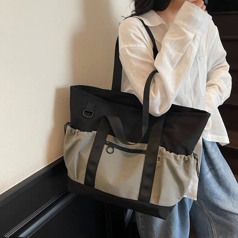 Women's lightweight oxford cloth travel and gym bag in grey colour with letter pattern