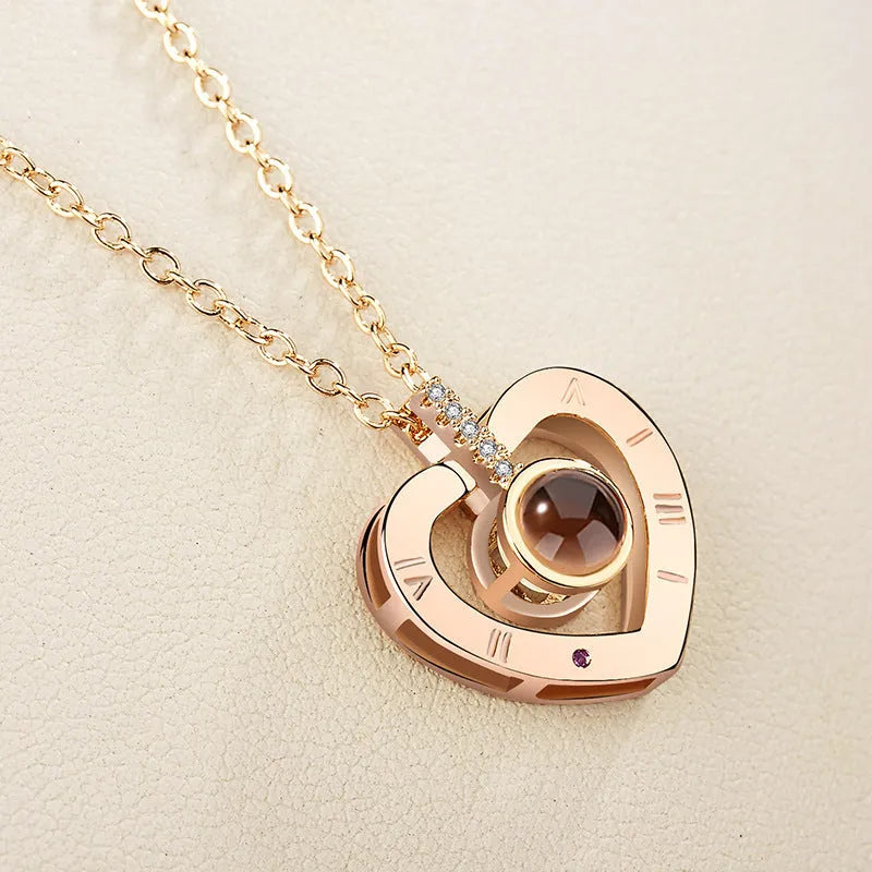 I love you 100 languages projection necklace, copper with gold plating, 50cm chain, pendant detail