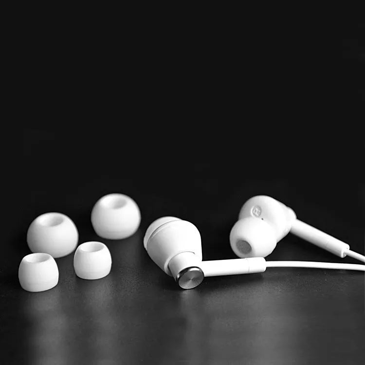 Black and white in-ear earphones with subwoofer for computer and mobile phone use