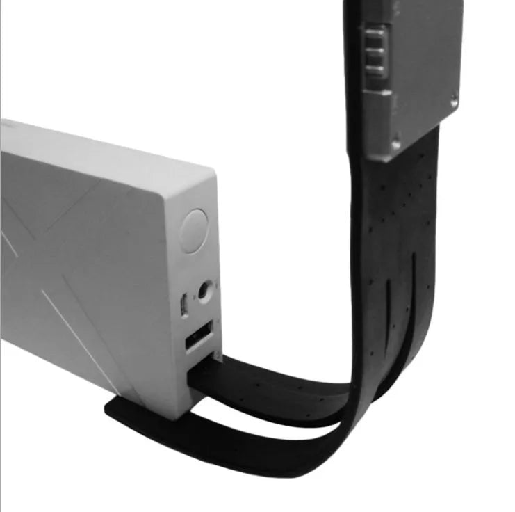 Black plastic folding LED reading lamp shown open and closed, highlighting its thin 9mm profile.